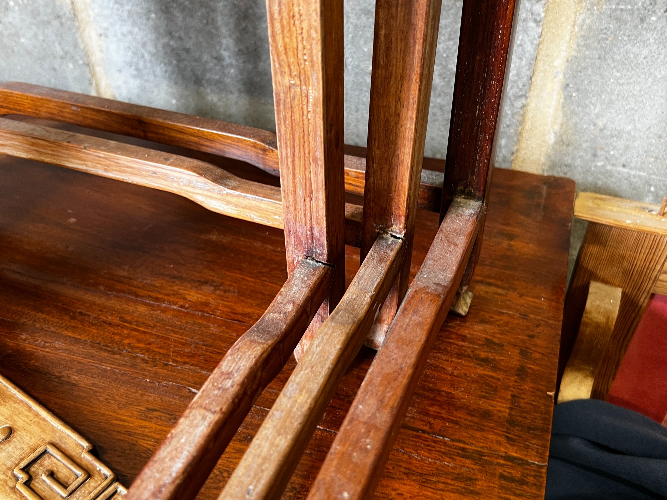 A nest of three Chinese rectangular hardwood tea tables, width 49cm, depth 35cm, height 59cm